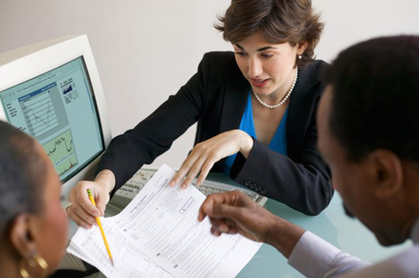 Women and man reviewing documents